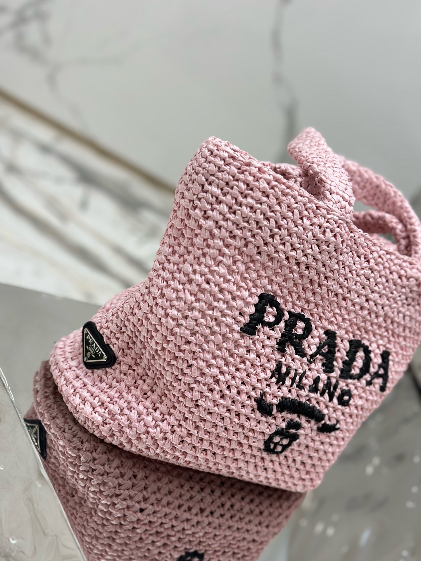 Pra*a small crochet tote bag in pink raffia-effect yarn