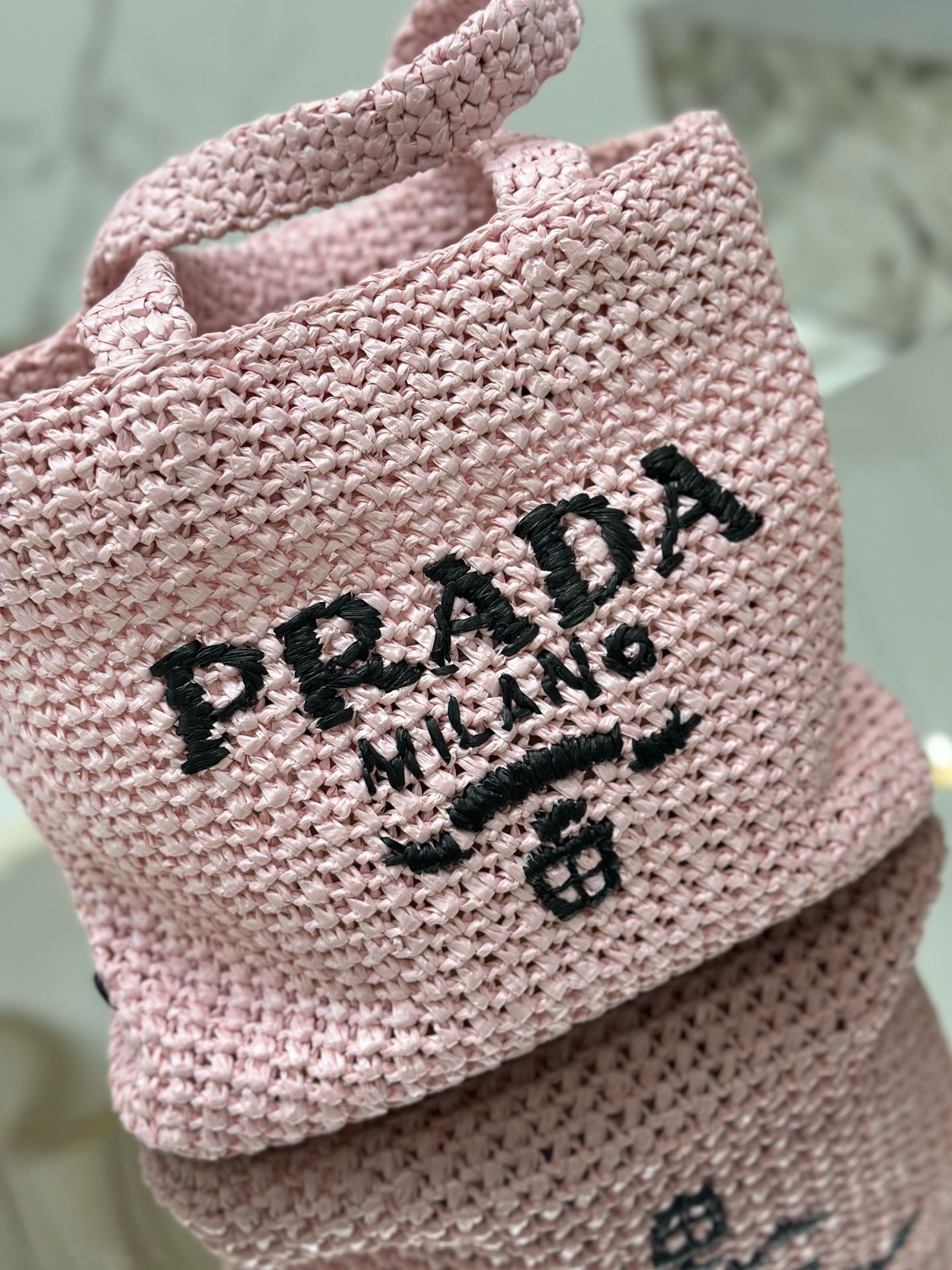 Pra*a small crochet tote bag in pink raffia-effect yarn