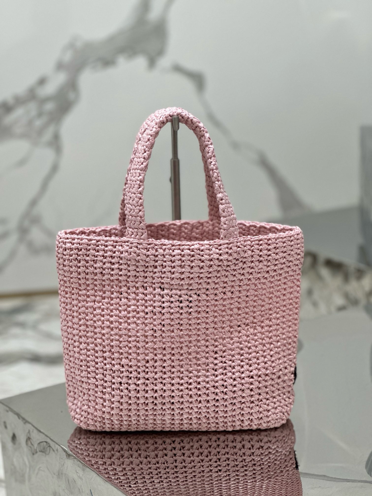 Pra*a small crochet tote bag in pink raffia-effect yarn