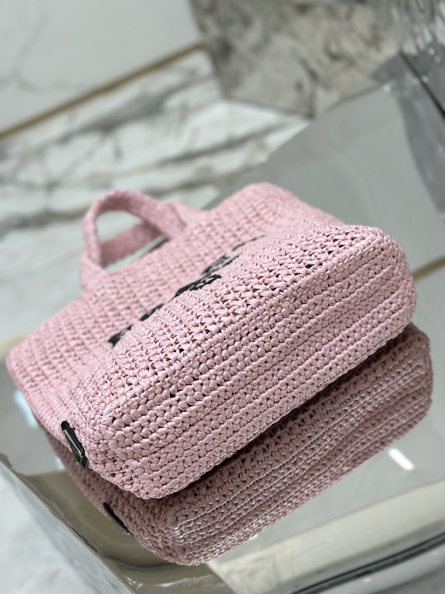 Pra*a small crochet tote bag in pink raffia-effect yarn