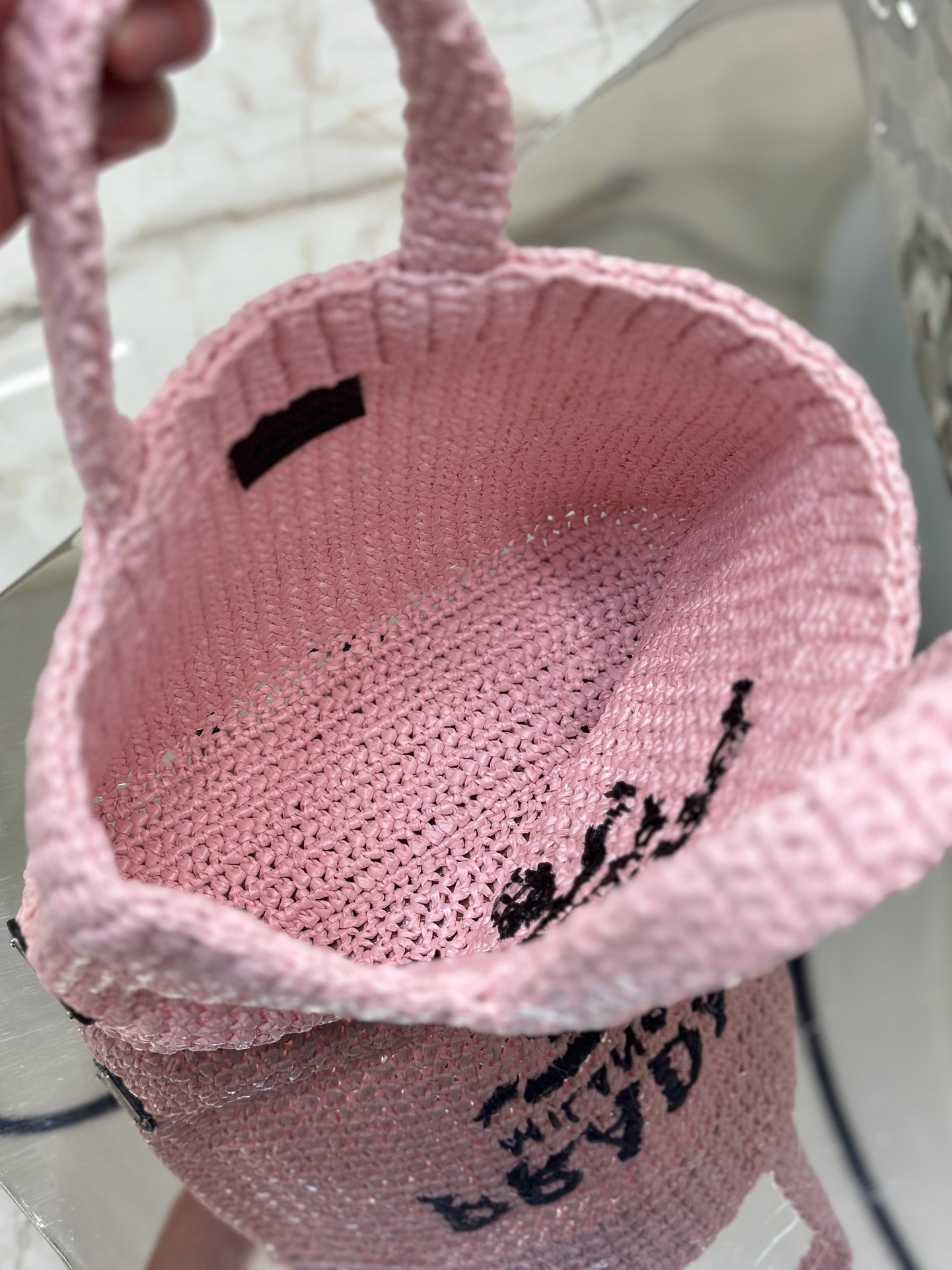 Pra*a small crochet tote bag in pink raffia-effect yarn