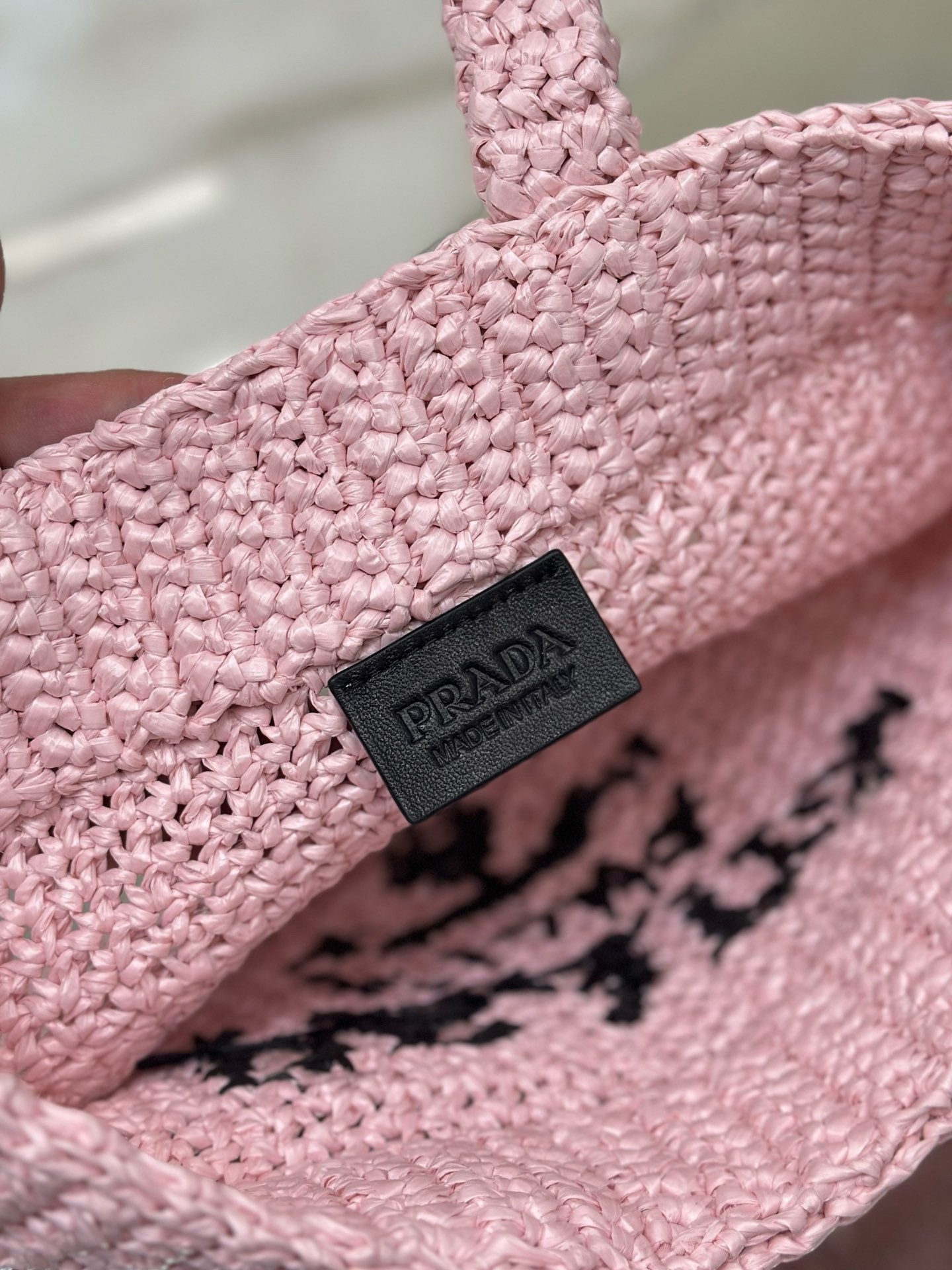 Pra*a small crochet tote bag in pink raffia-effect yarn