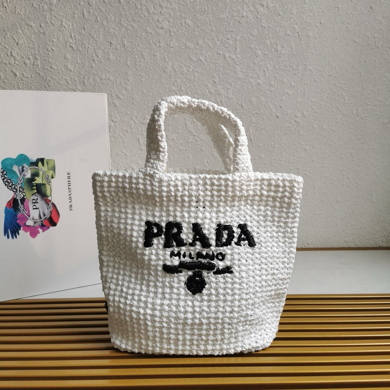 Pra*a small crochet tote bag in white raffia-effect yarn