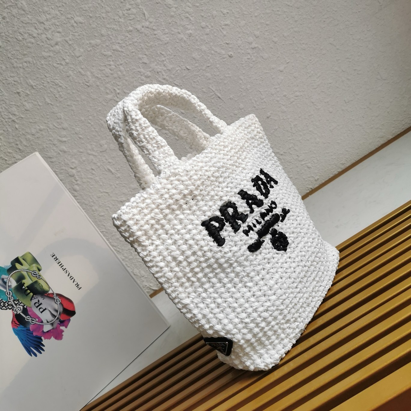 Pra*a small crochet tote bag in white raffia-effect yarn