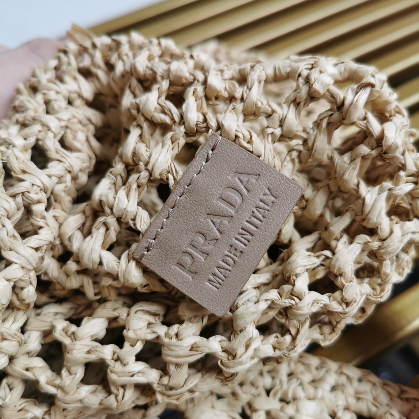 Pra*a large tote bag in beige woven raffia