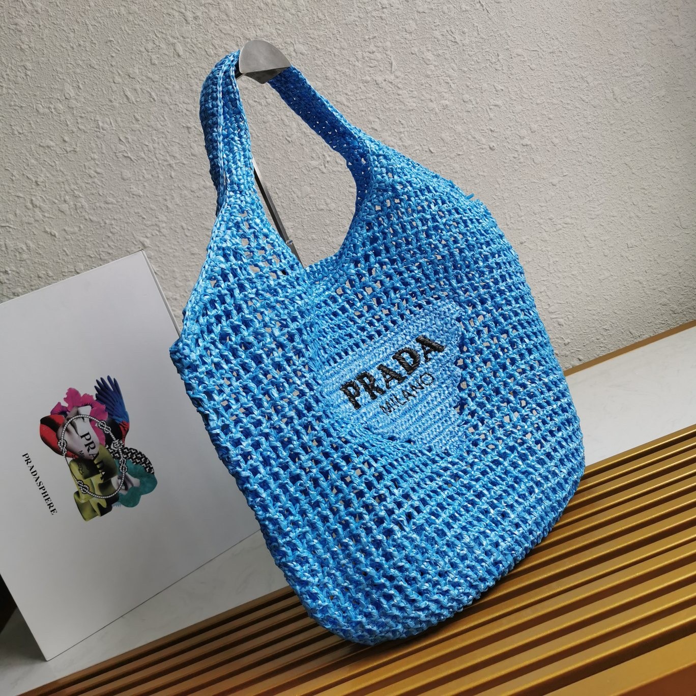 Pra*a large tote bag in blue woven raffia