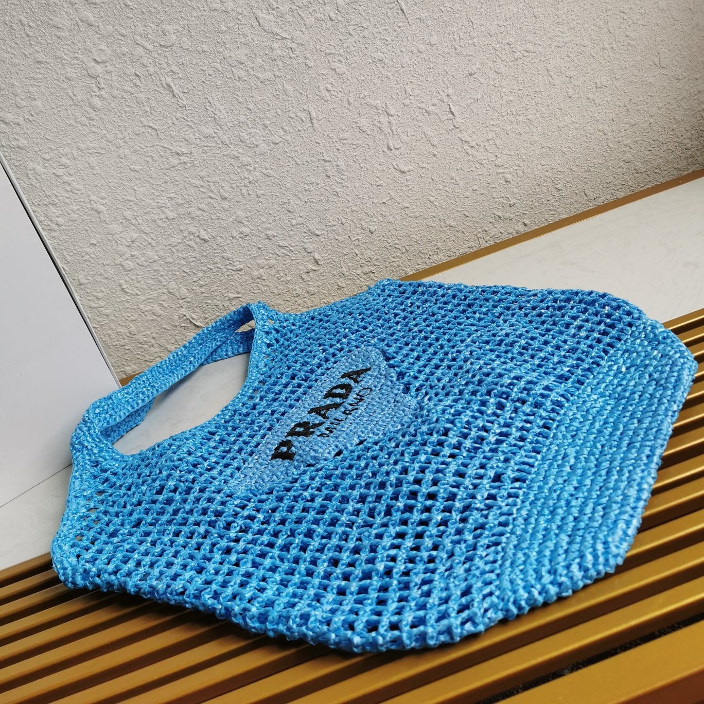 Pra*a large tote bag in blue woven raffia