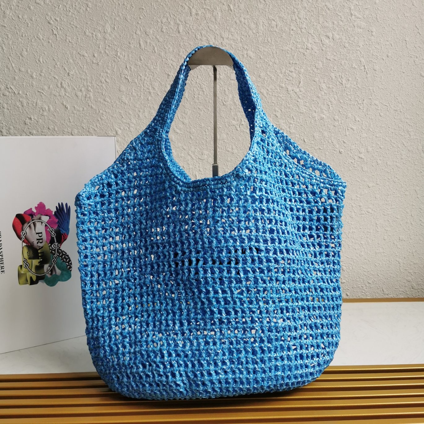 Pra*a large tote bag in blue woven raffia