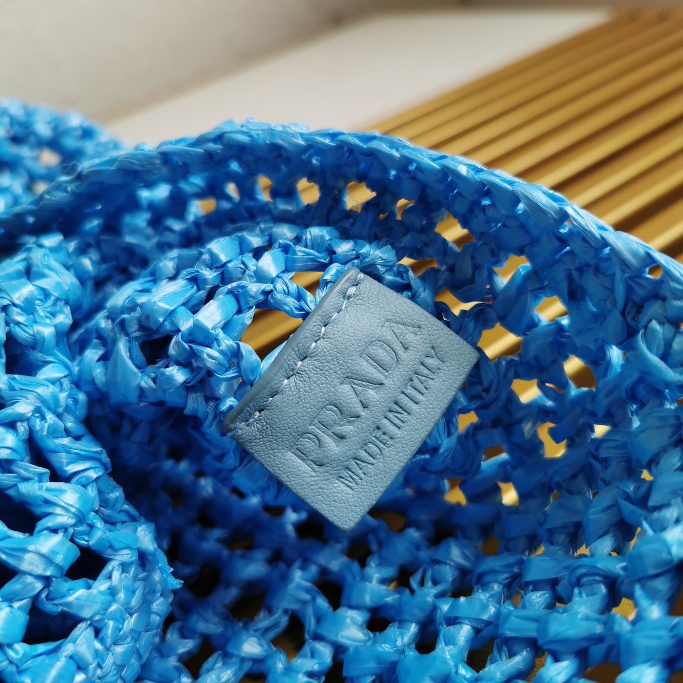 Pra*a large tote bag in blue woven raffia