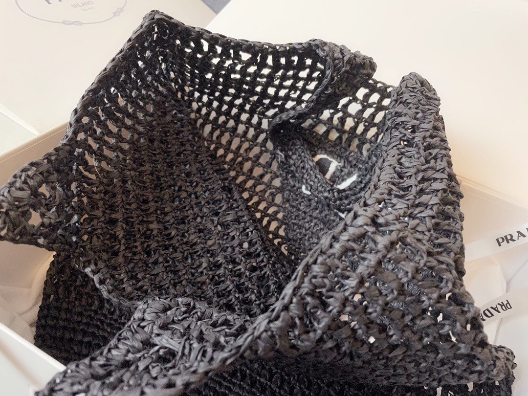 Pra*a large tote bag in black woven raffia