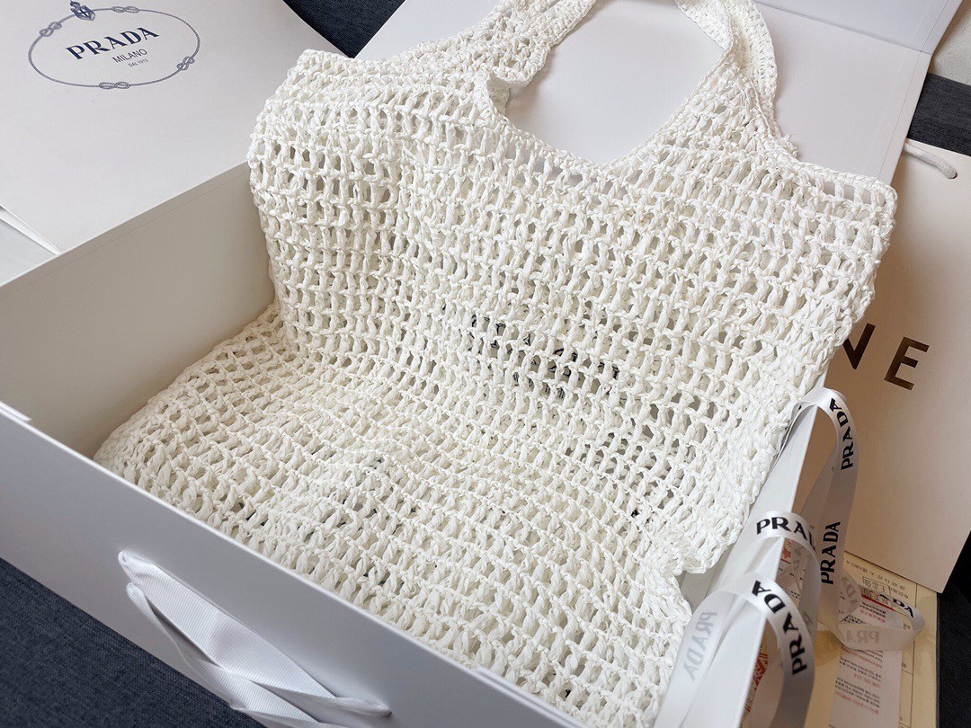 Pra*a large tote bag in white woven raffia