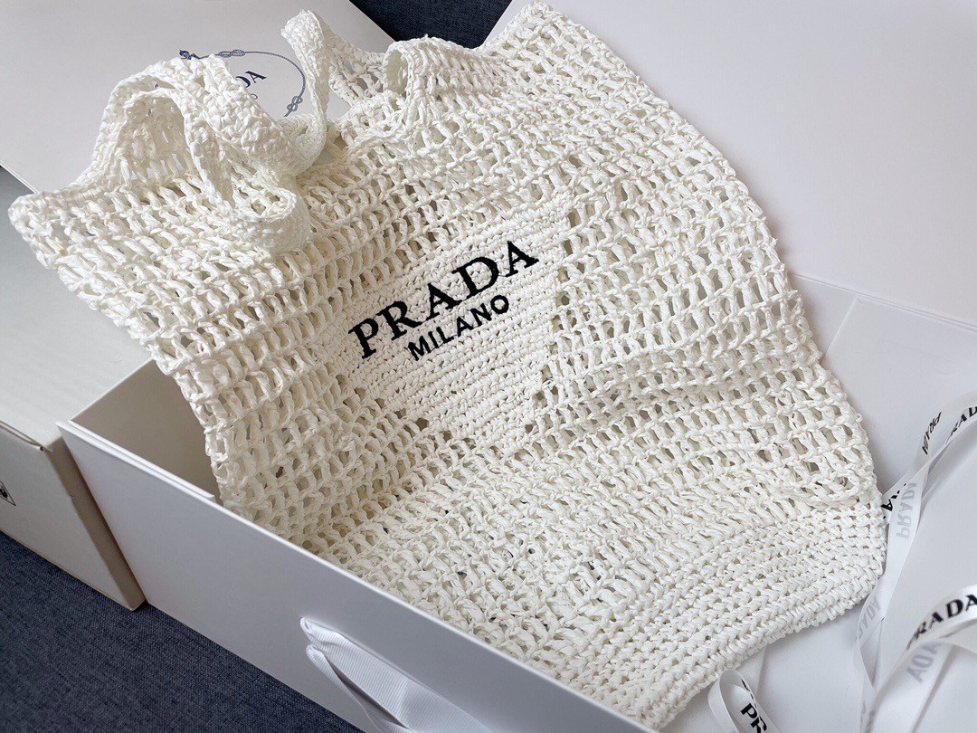 Pra*a large tote bag in white woven raffia
