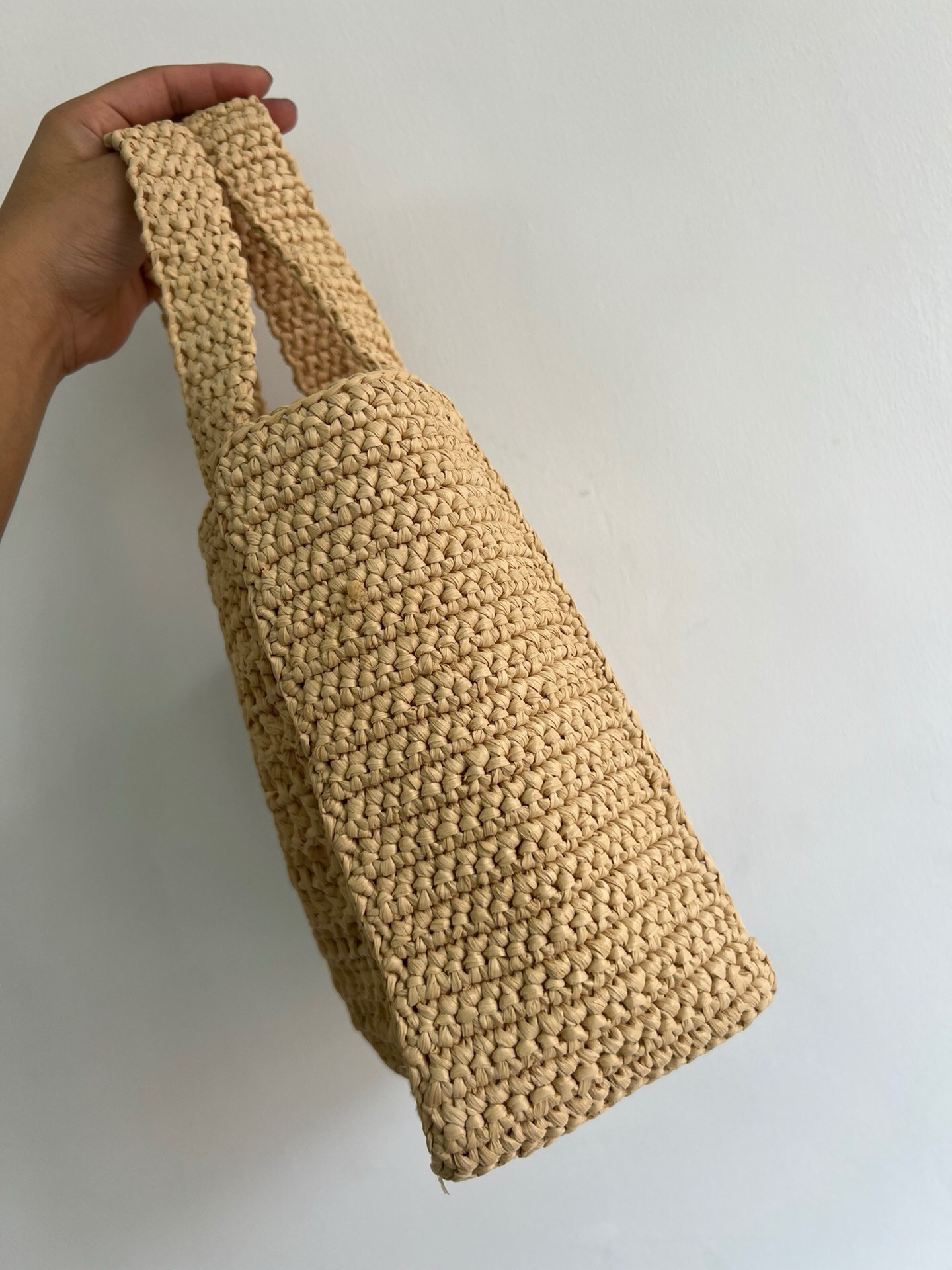 Pra*a small crochet tote in beige raffia-effect yarn