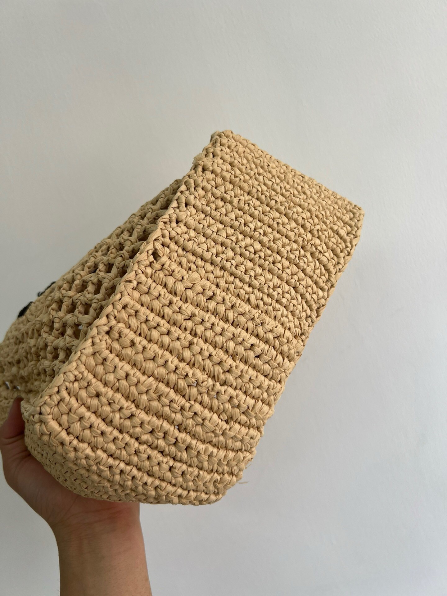 Pra*a small crochet tote in beige raffia-effect yarn