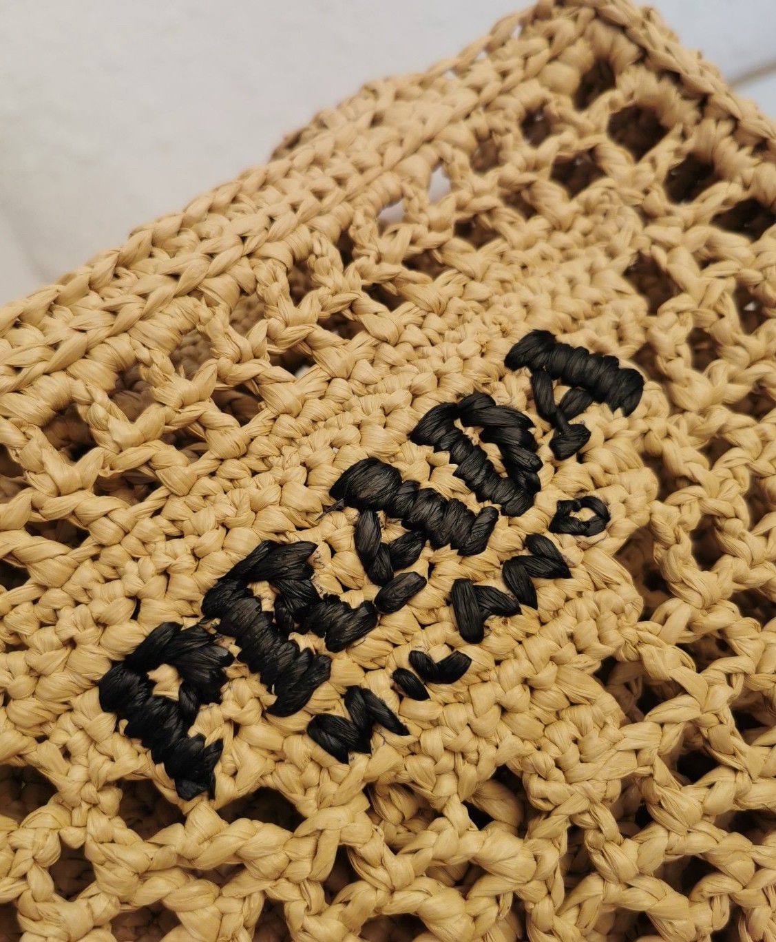 Pra*a small crochet tote in beige raffia-effect yarn