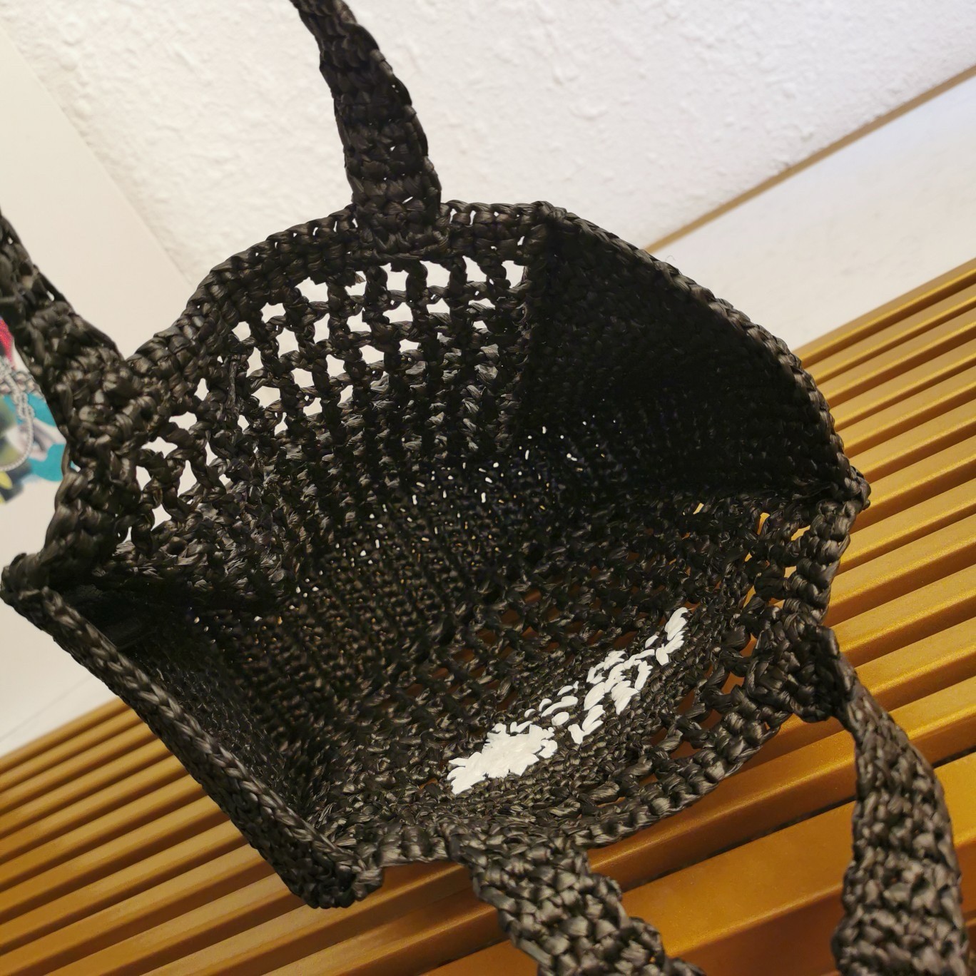 Pra*a small crochet tote in black raffia-effect yarn