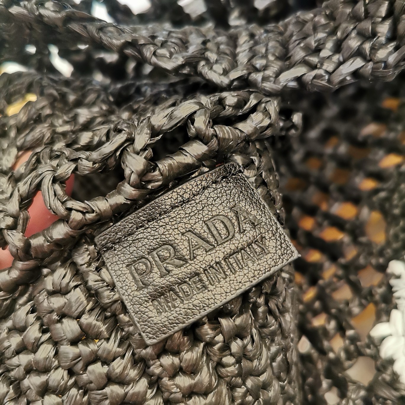 Pra*a small crochet tote in black raffia-effect yarn