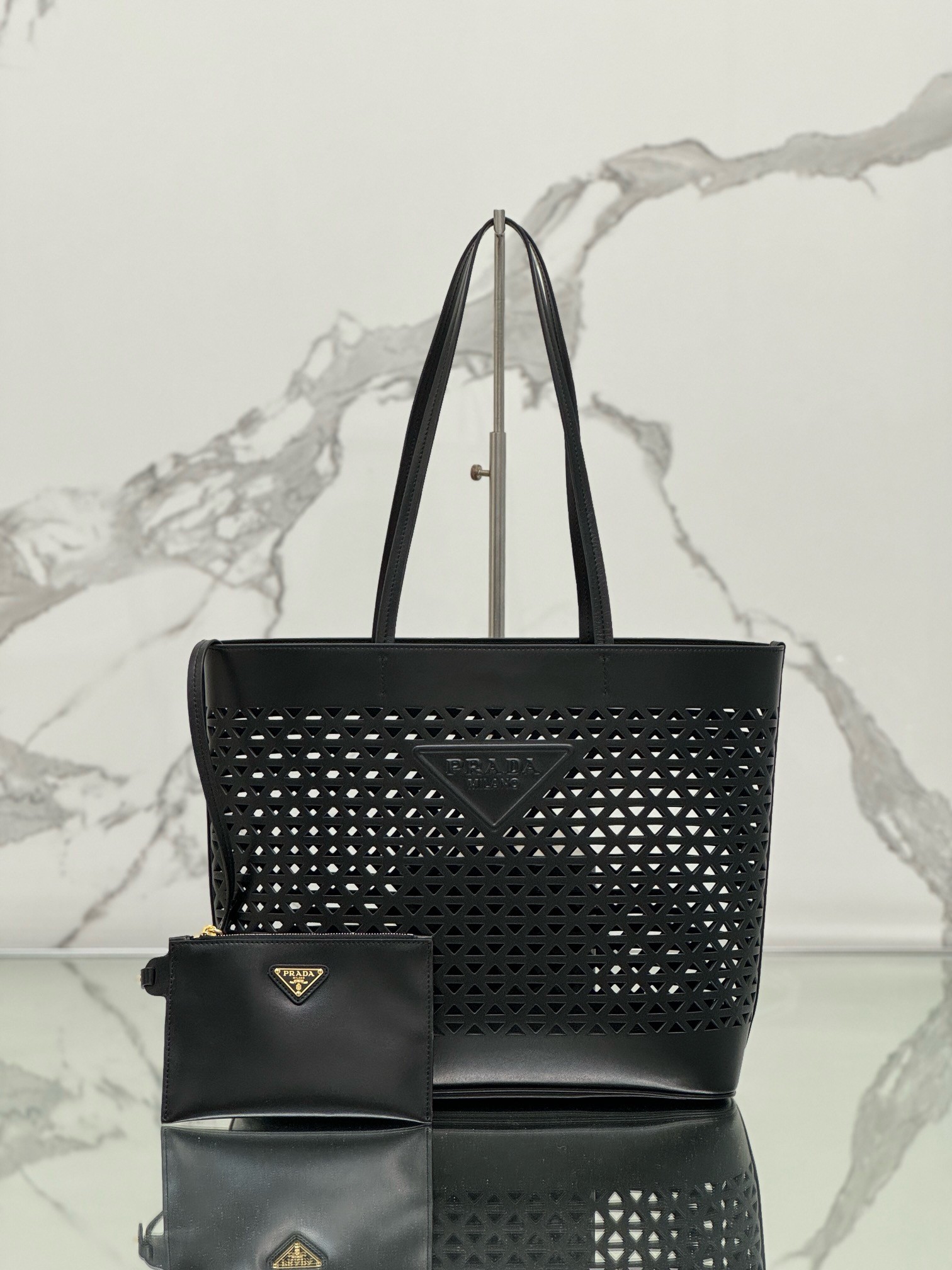 Pra*a large tote bag in black perforated leather