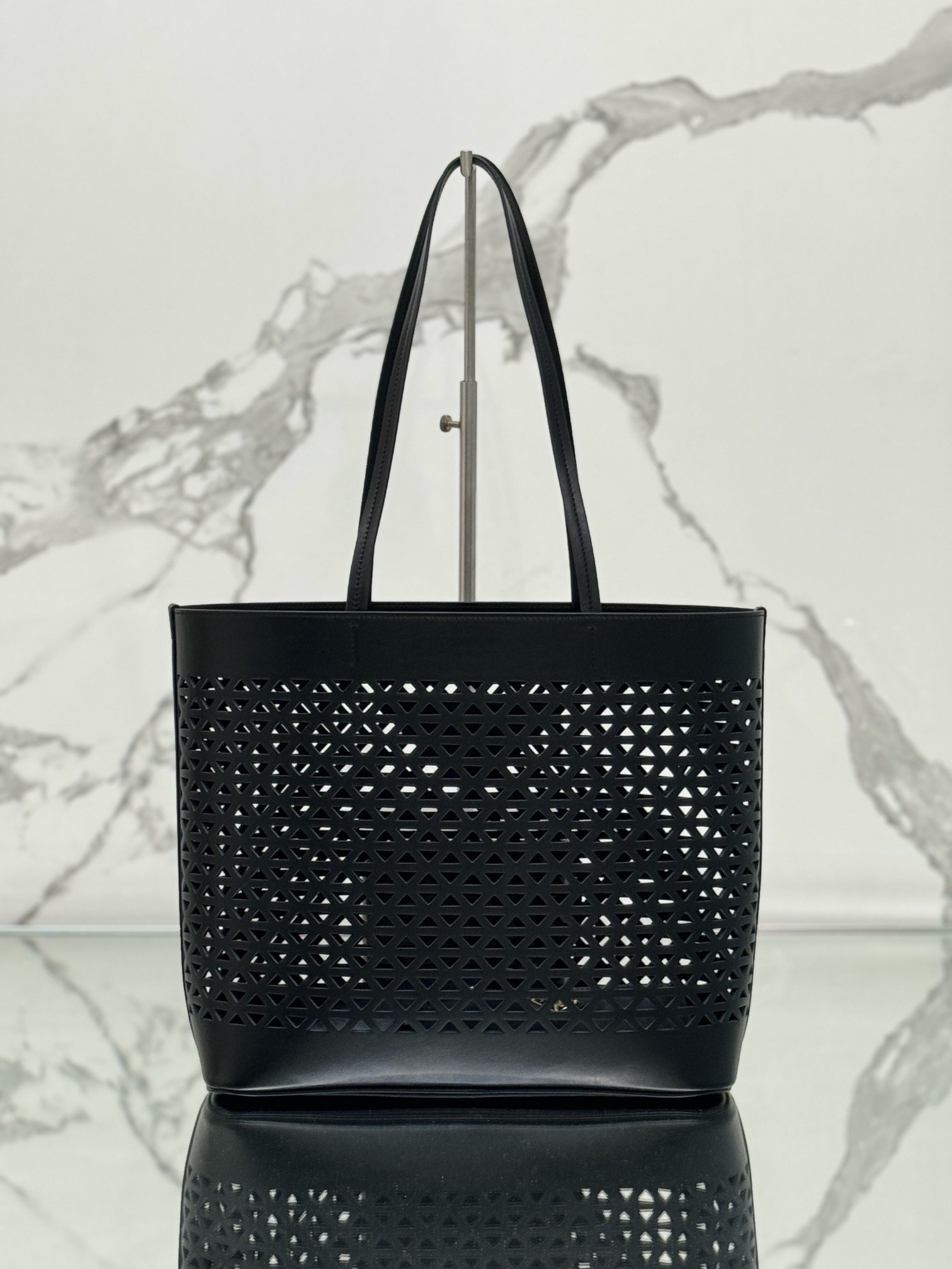 Pra*a large tote bag in black perforated leather