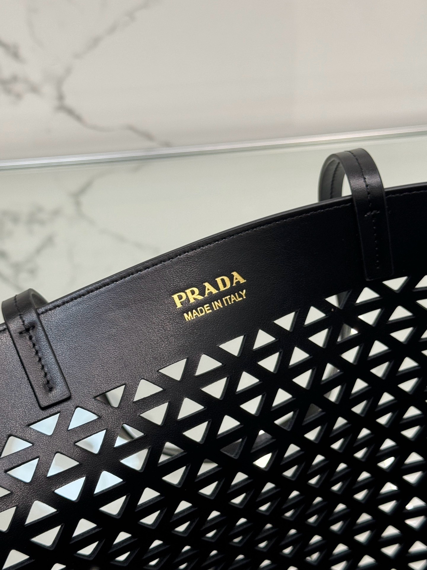 Pra*a large tote bag in black perforated leather