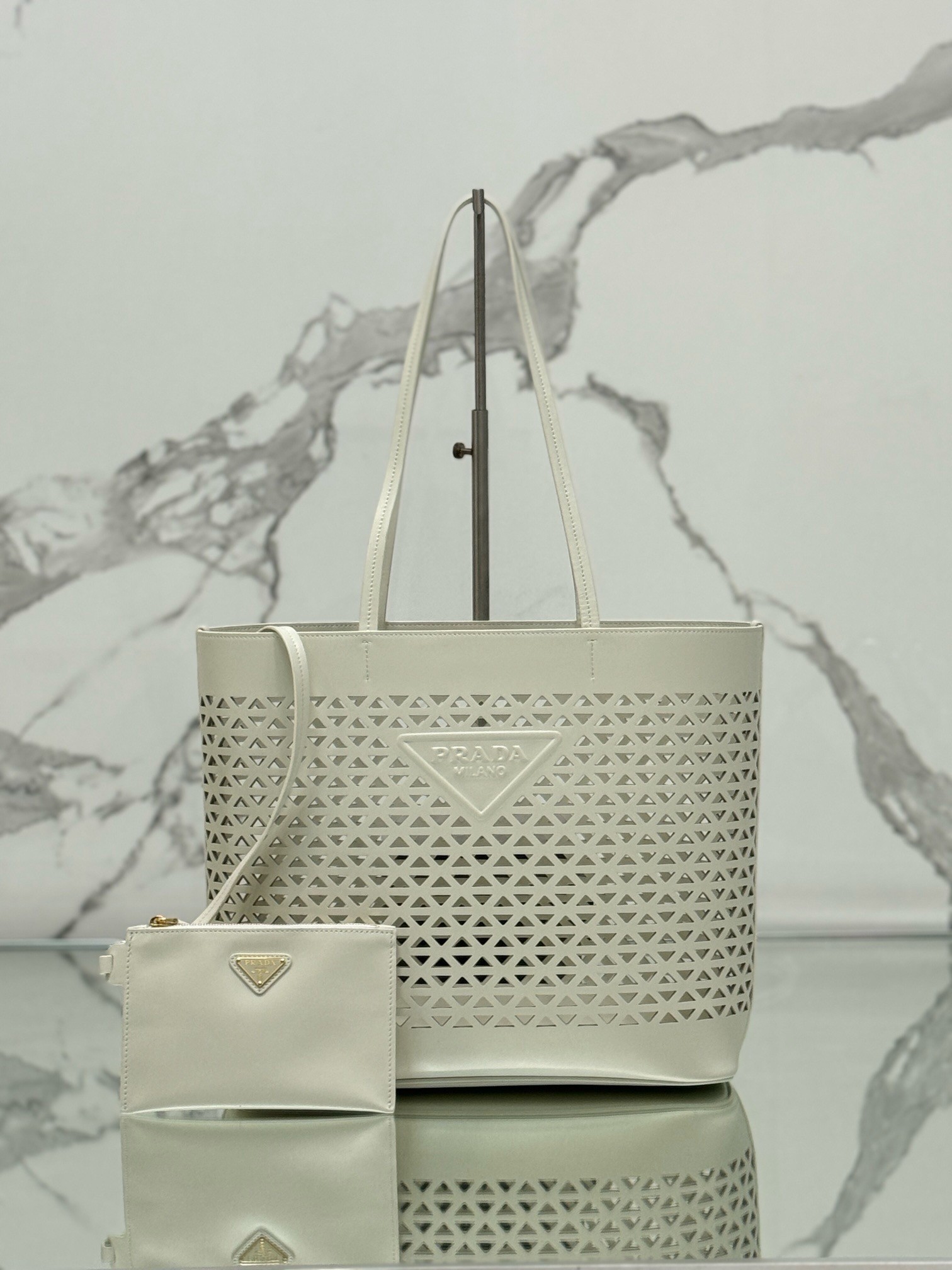 Pra*a large tote bag in white perforated leather