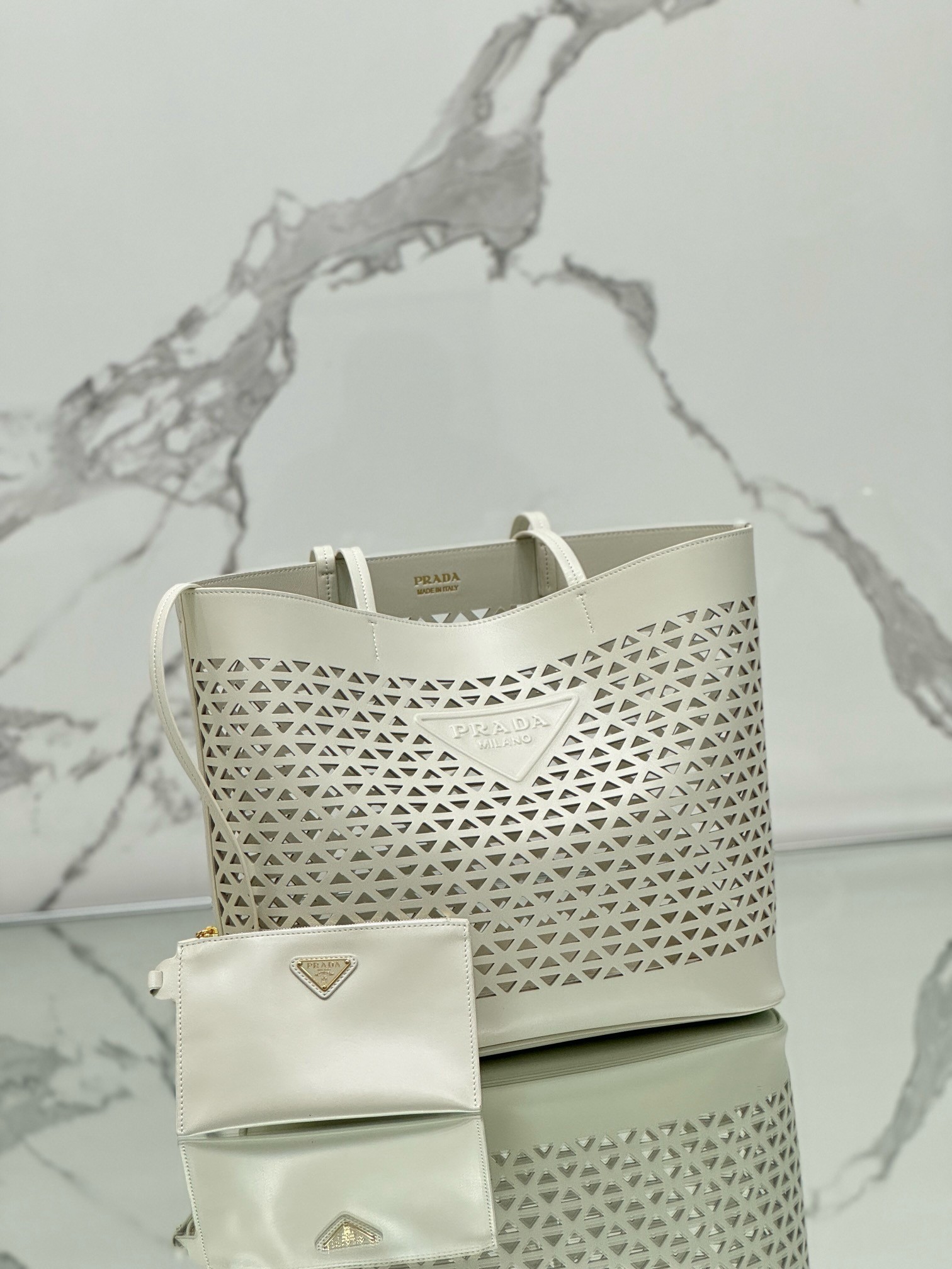 Pra*a large tote bag in white perforated leather