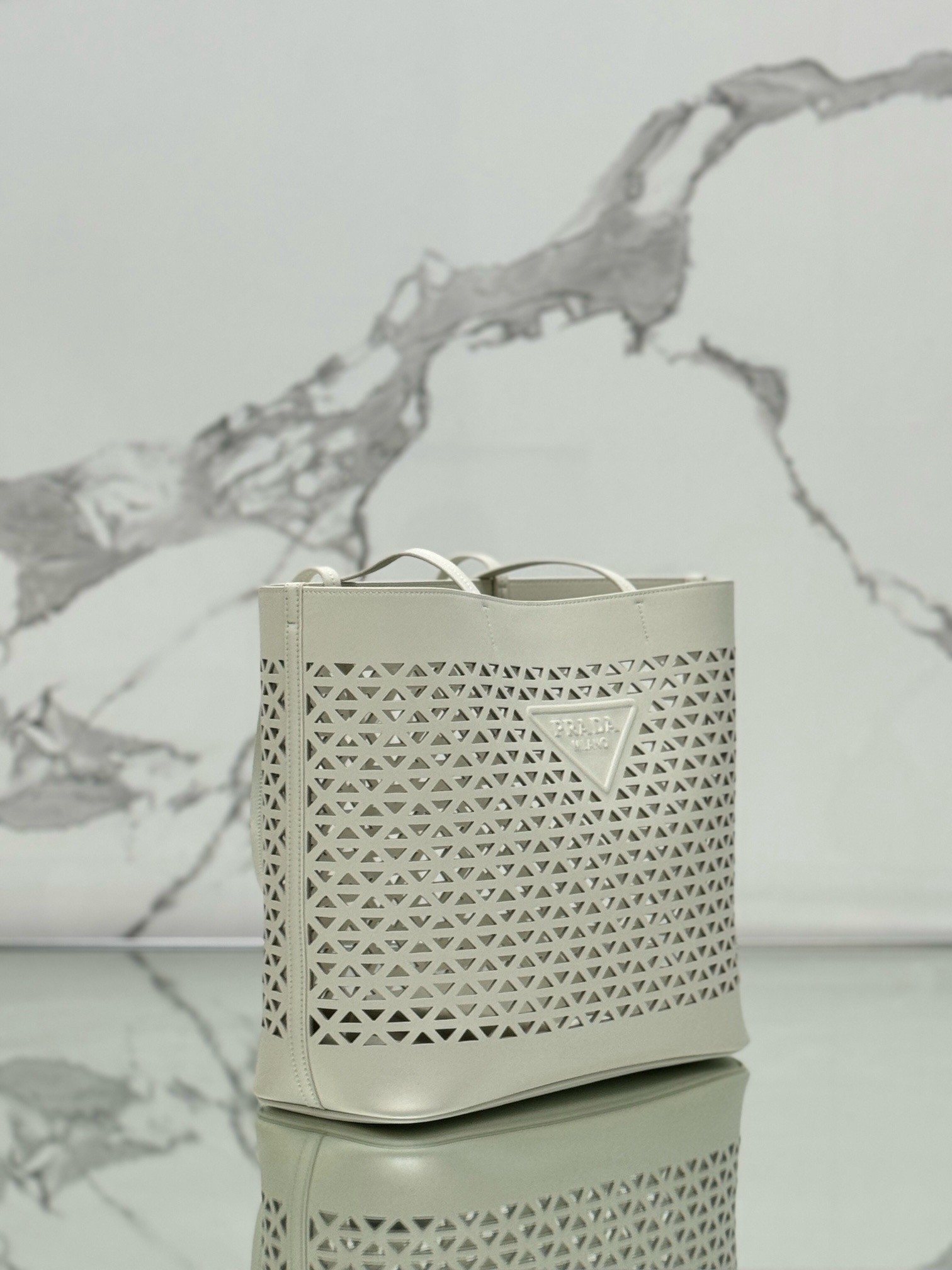 Pra*a large tote bag in white perforated leather
