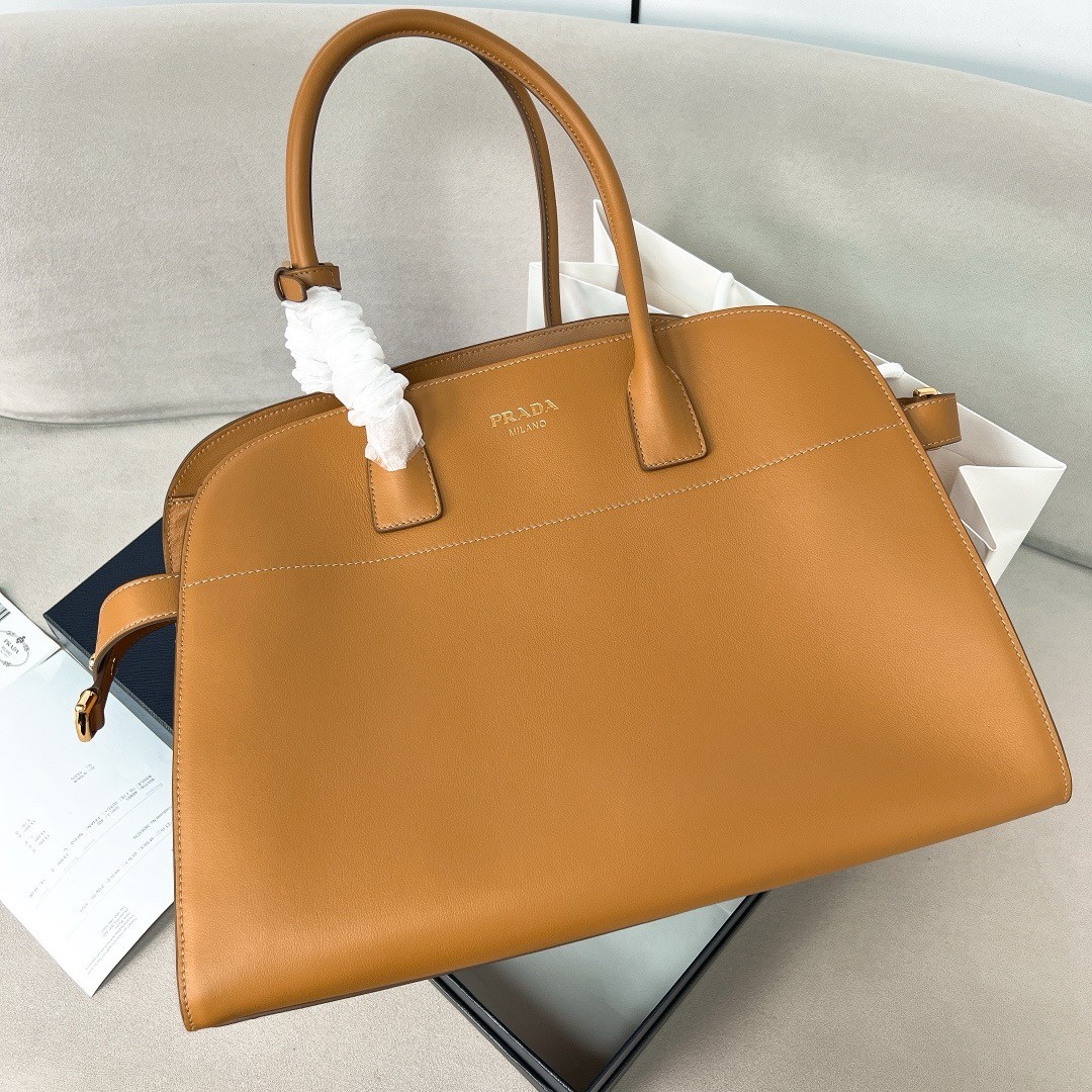 Pra*a large tote bag in brown leather with buckles