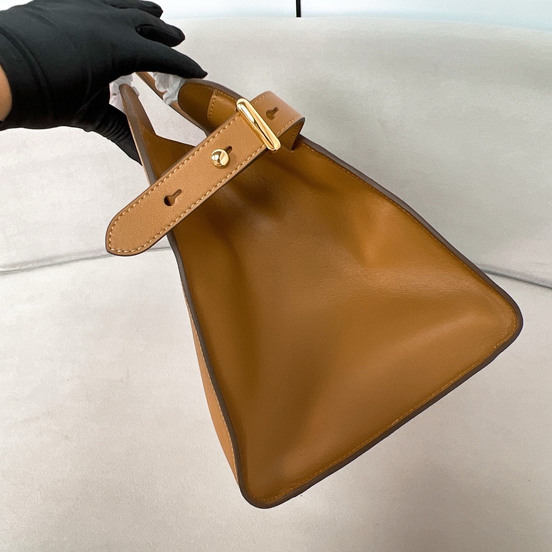 Pra*a large tote bag in brown leather with buckles
