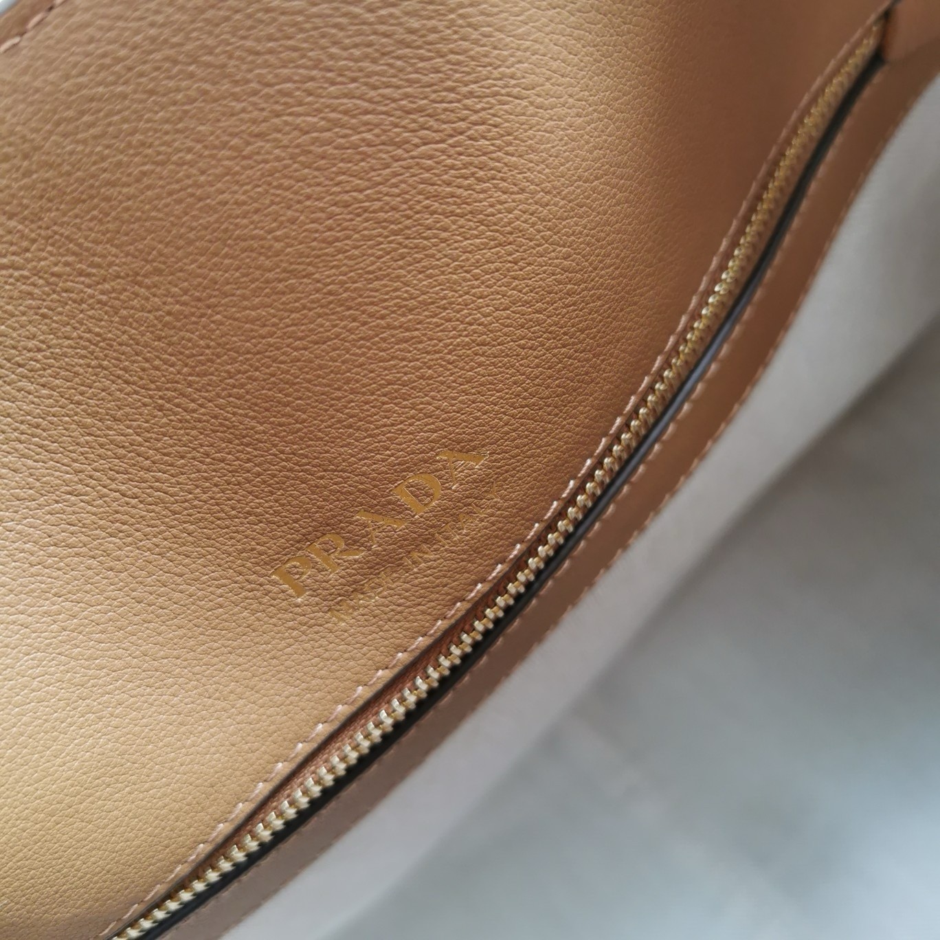 Pra*a large tote bag in caramel smooth calfskin