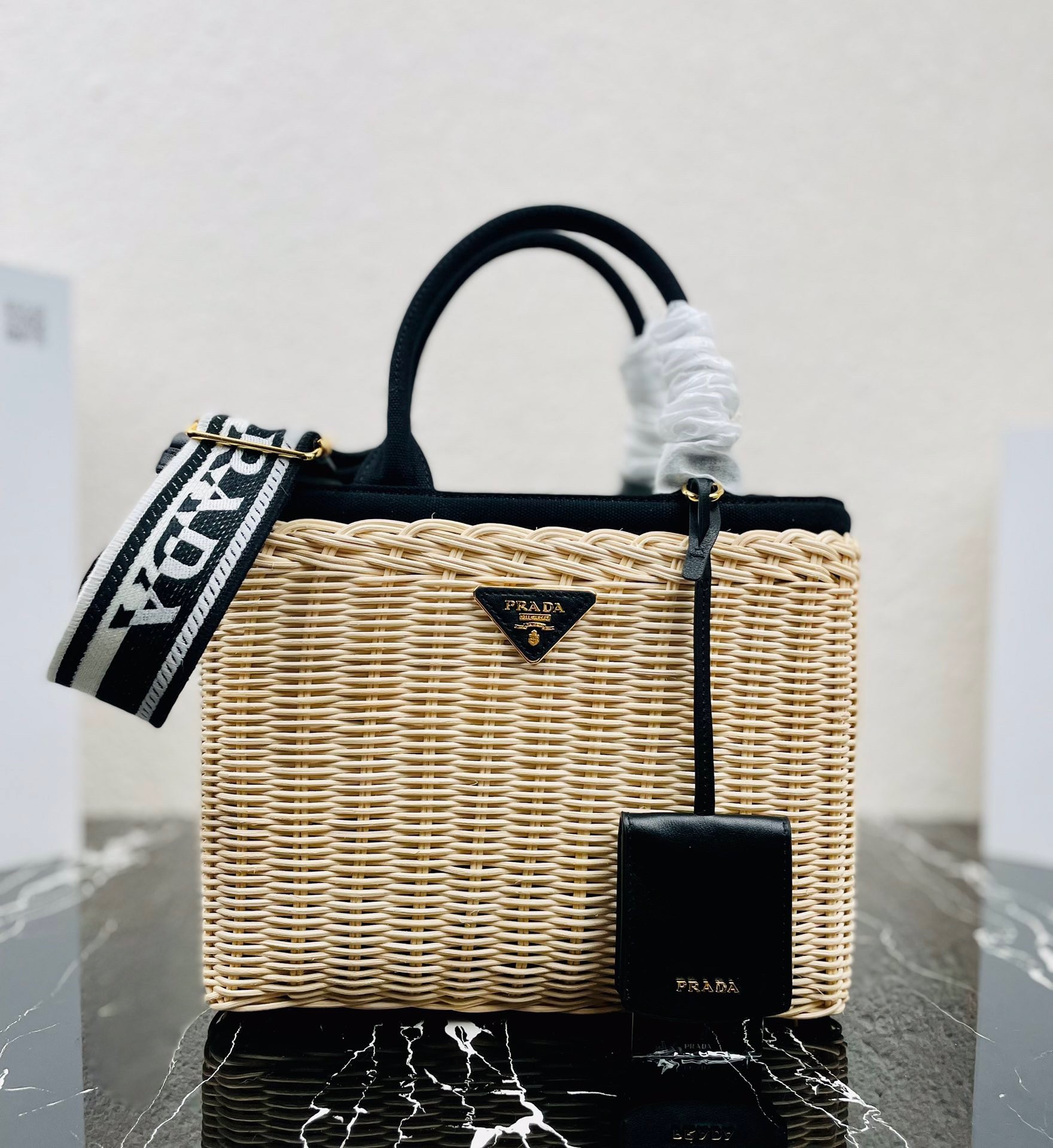 Pra*a tote bag in wicker and black canvas