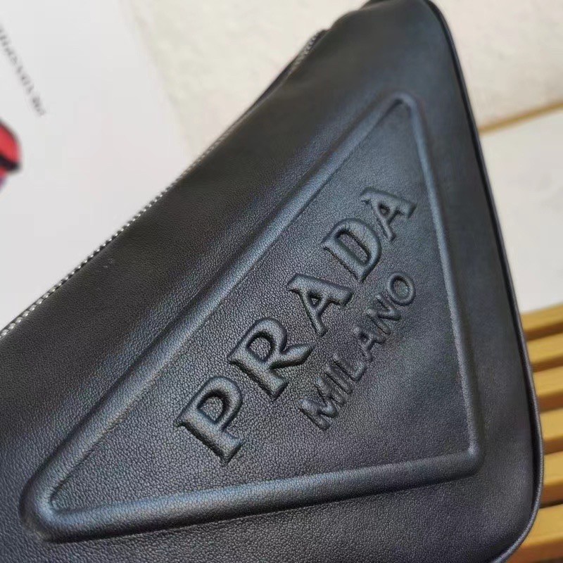 Pra*a triangle shoulder bag in black leather