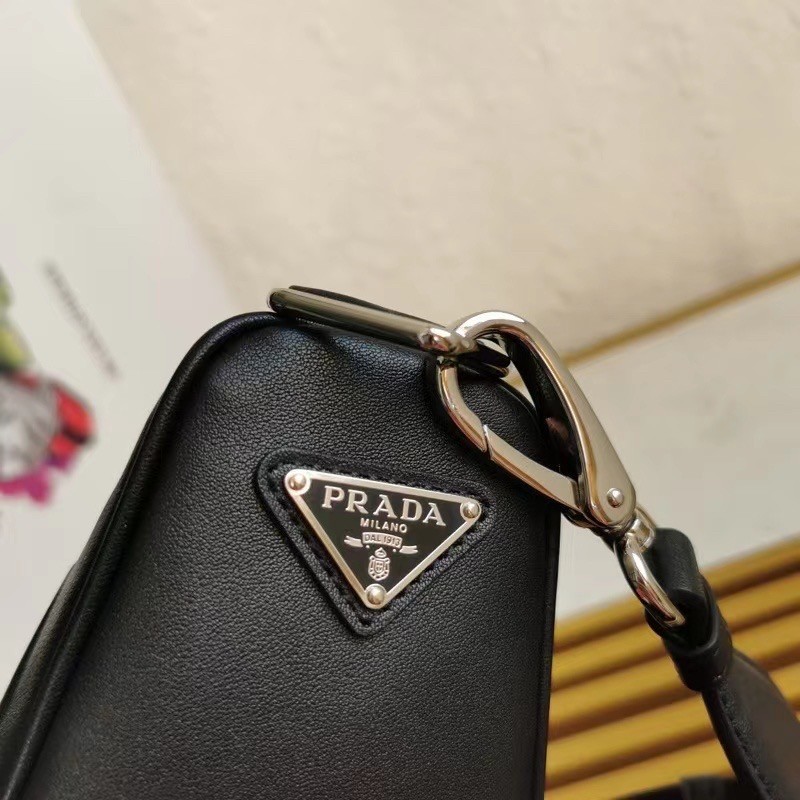 Pra*a triangle shoulder bag in black leather