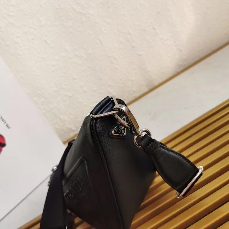 Pra*a triangle shoulder bag in black leather