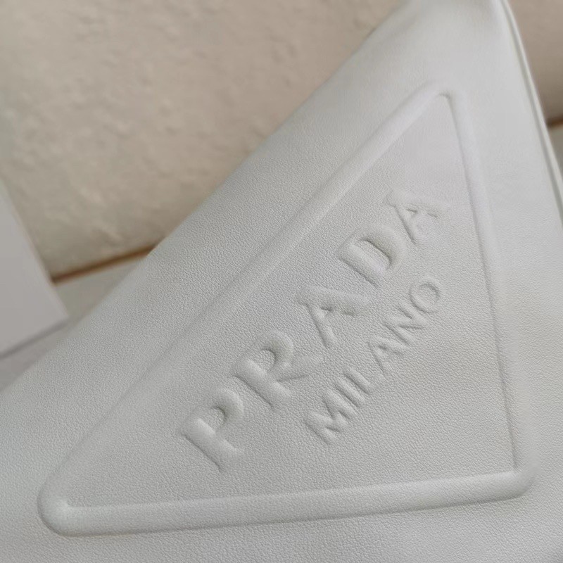Pra*a triangle shoulder bag in white leather