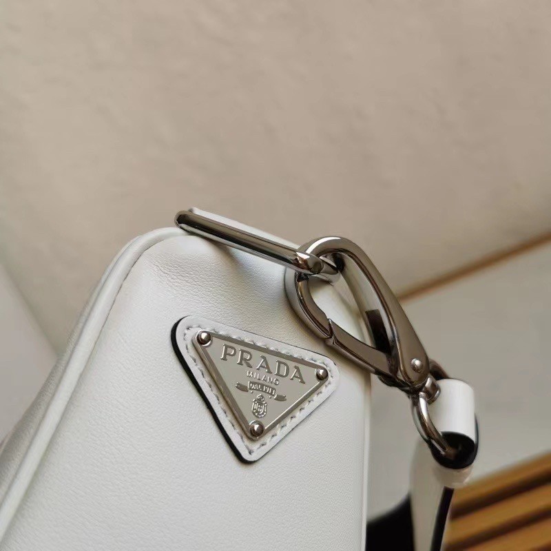 Pra*a triangle shoulder bag in white leather