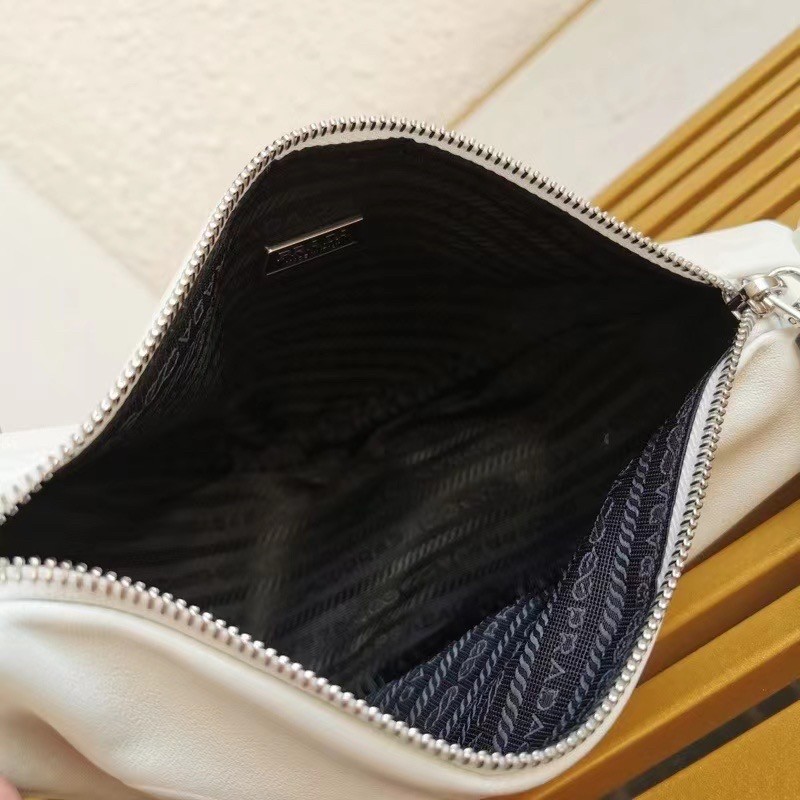 Pra*a triangle shoulder bag in white leather
