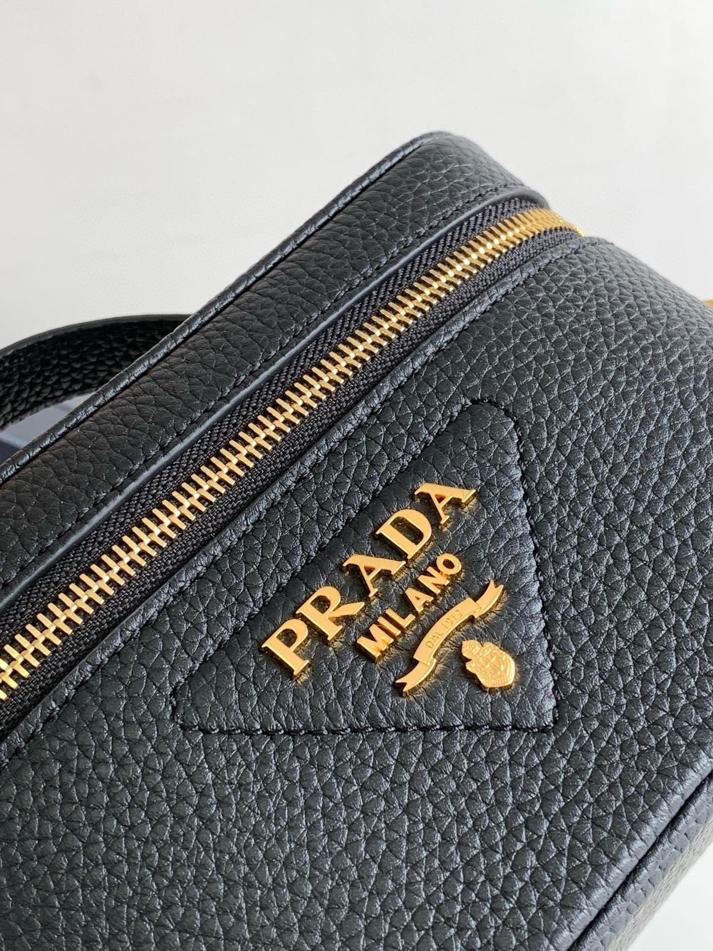 Pra*a mini vanity bag in black grained leather