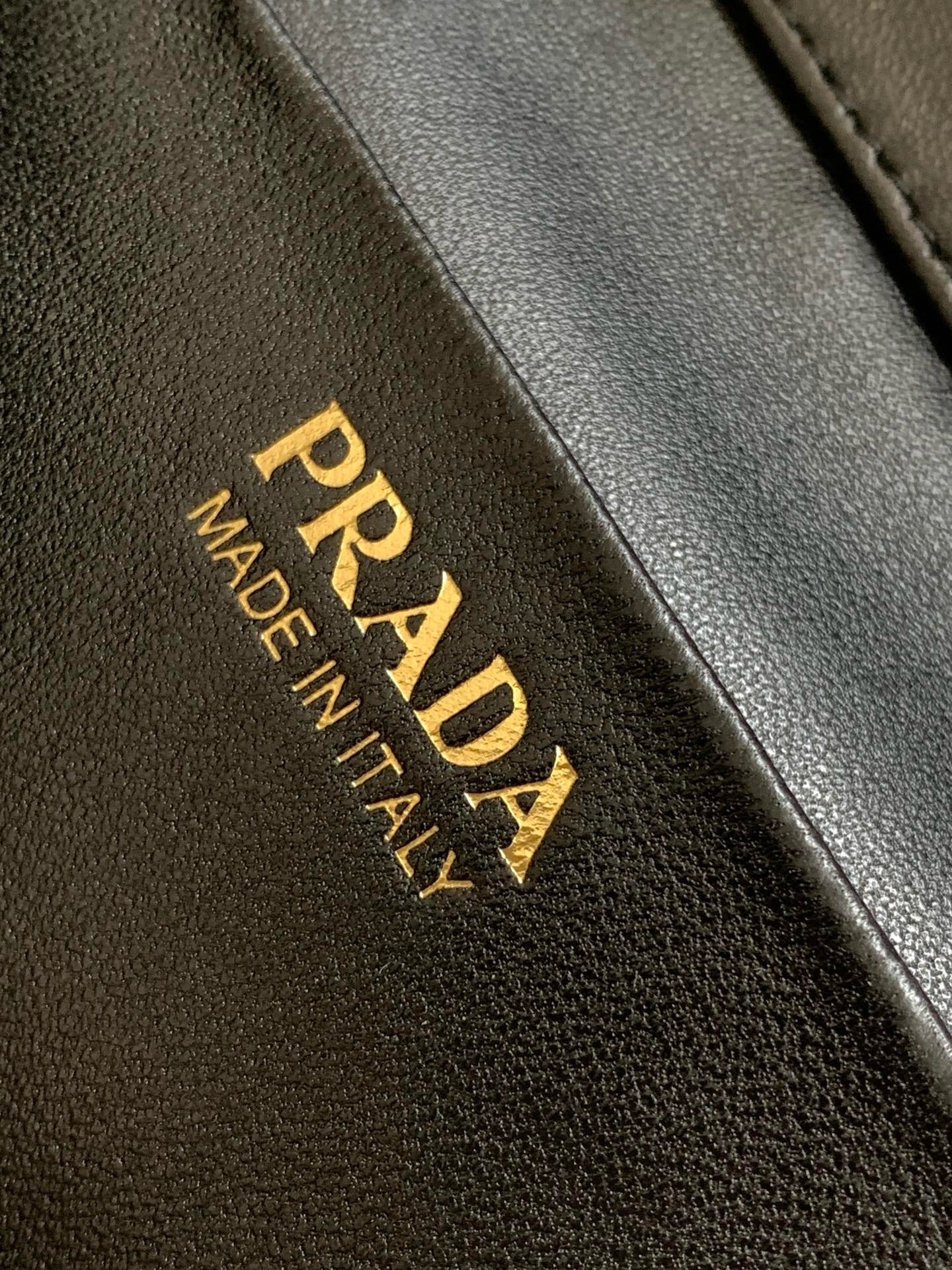 Pra*a mini vanity bag in black grained leather