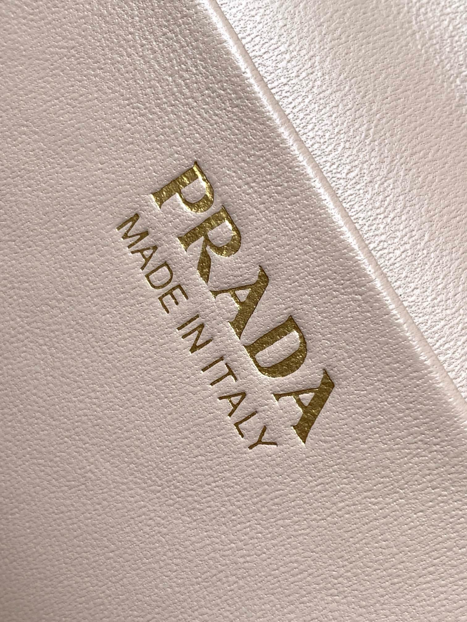 Pra*a mini vanity bag in light pink grained leather