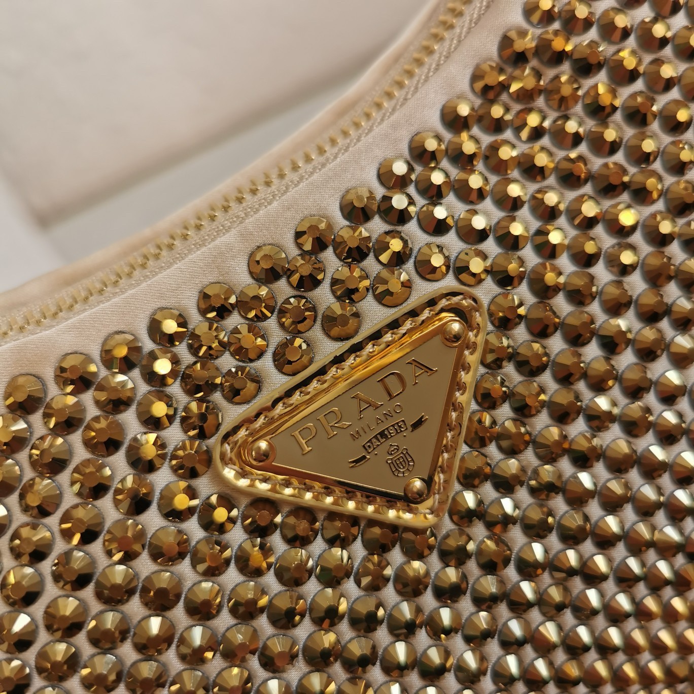 Pra*a re-edition 2005 bag in gold satin with crystal