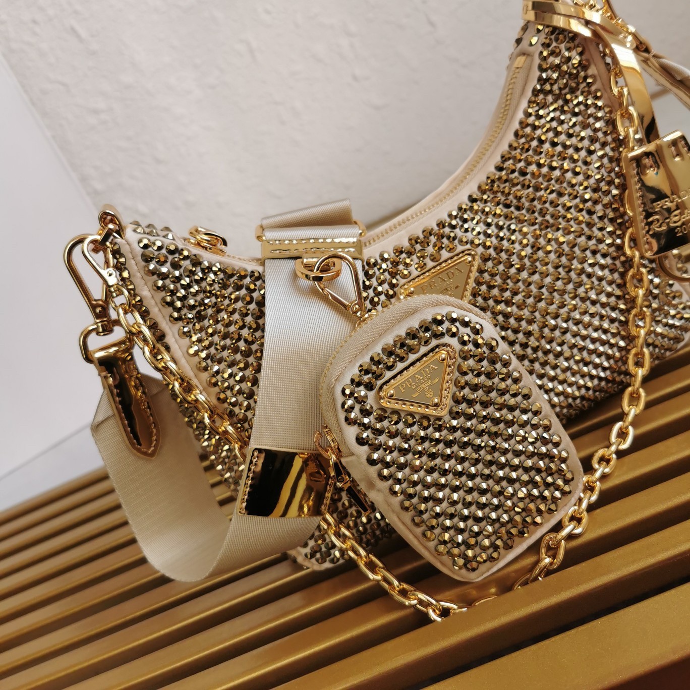 Pra*a re-edition 2005 bag in gold satin with crystal