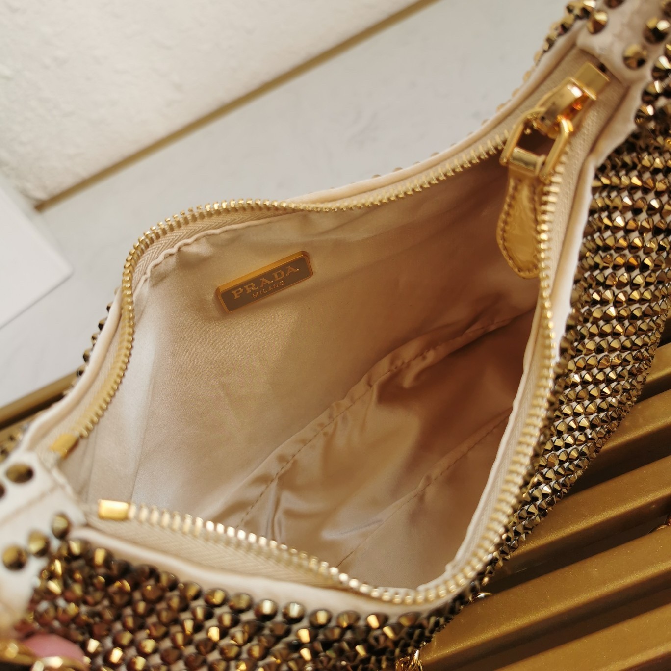 Pra*a re-edition 2005 bag in gold satin with crystal