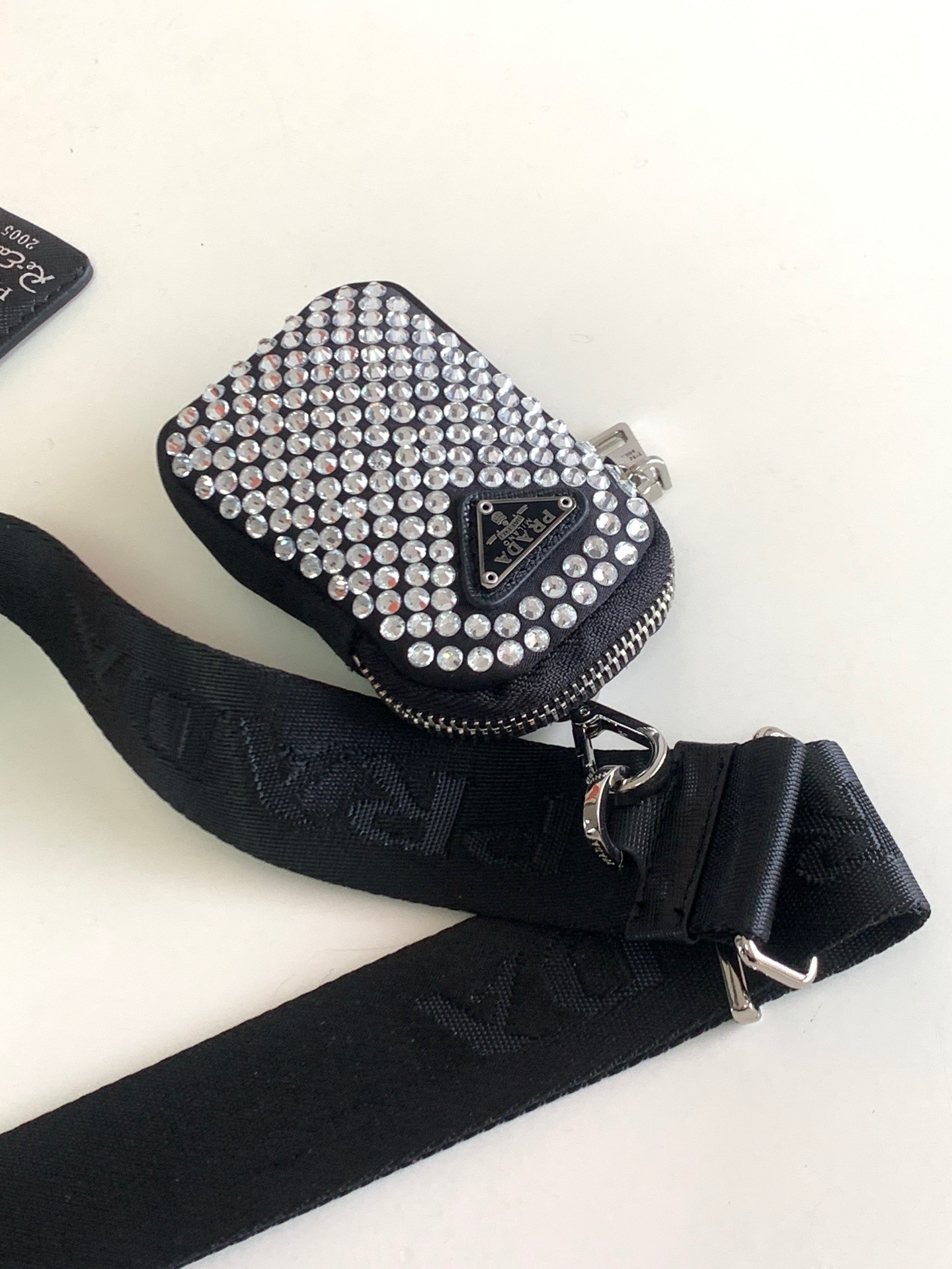 Pra*a re-edition 2005 bag in black satin with crystals