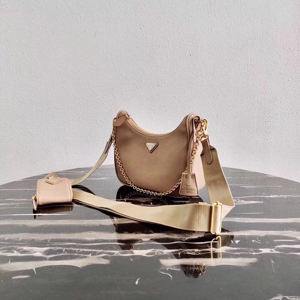 Pra*a re-edition 2005 shoulder bag in beige saffiano leather