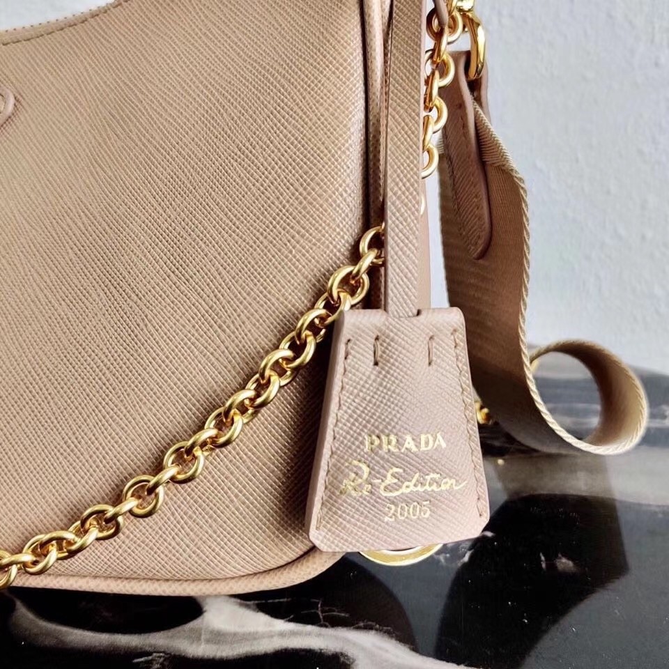Pra*a re-edition 2005 shoulder bag in beige saffiano leather