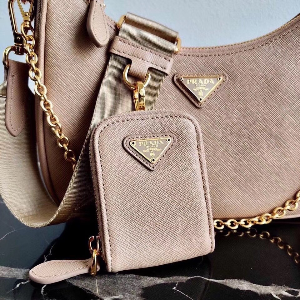 Pra*a re-edition 2005 shoulder bag in beige saffiano leather