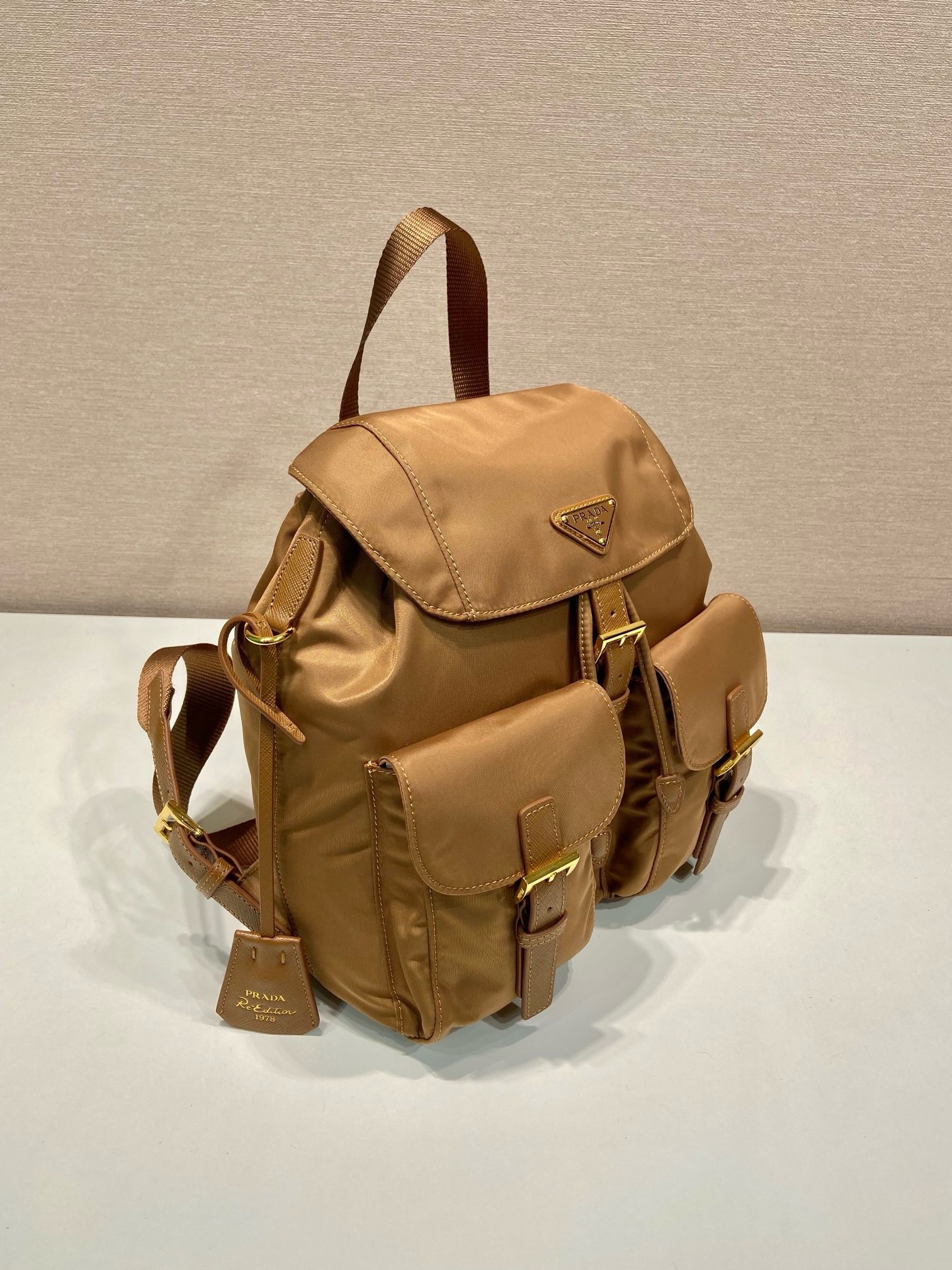 Pra*a re-edition 1978 small backpack in brown re-nylon