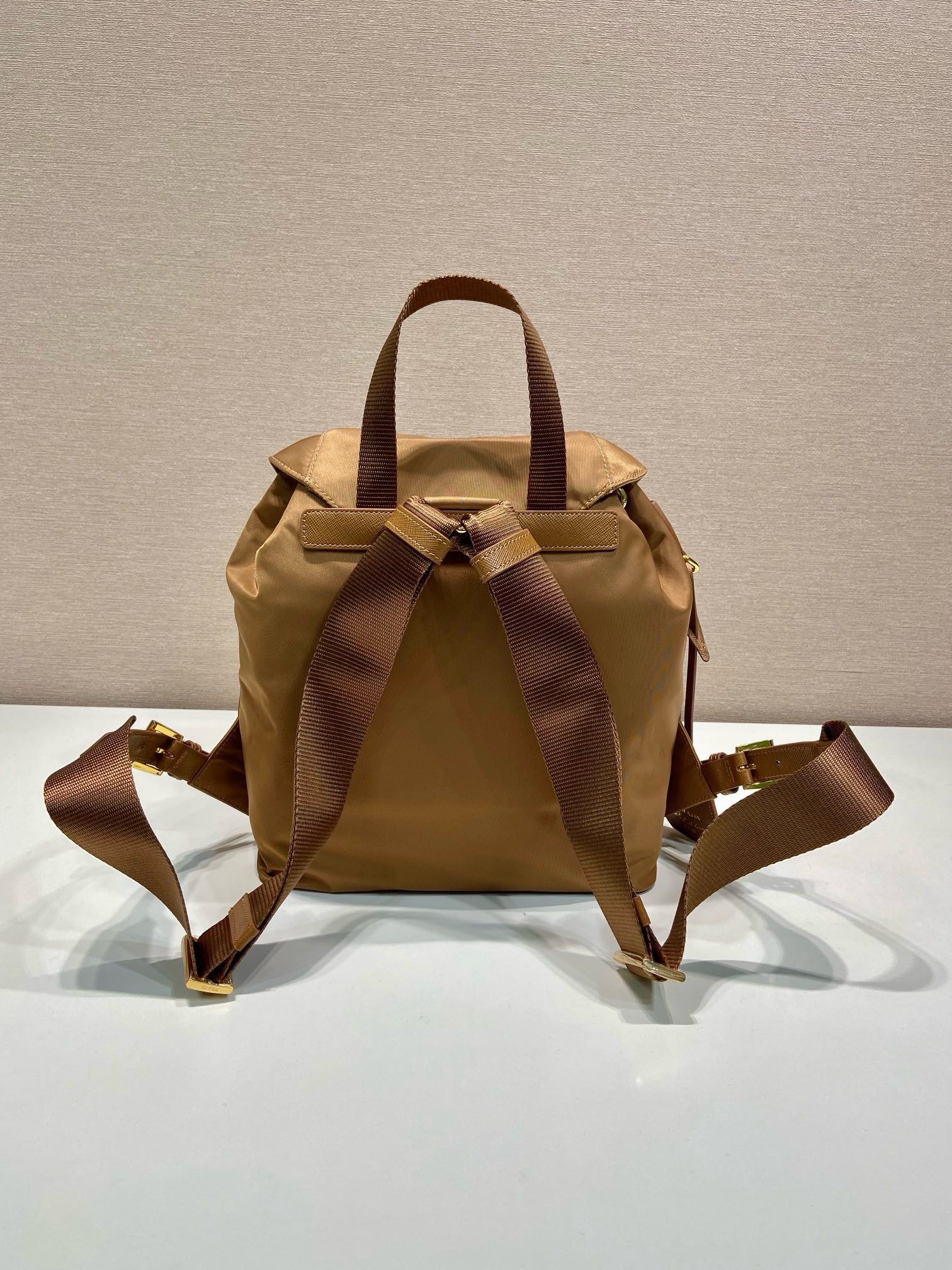 Pra*a re-edition 1978 small backpack in brown re-nylon