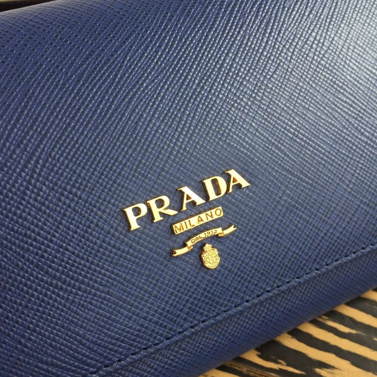 Pra*a continental wallet in blue saffiano leather